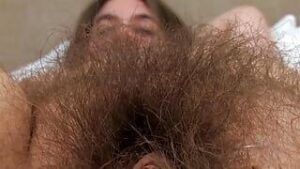 hairy pussy babe brooke strips down to show off her amazing fur